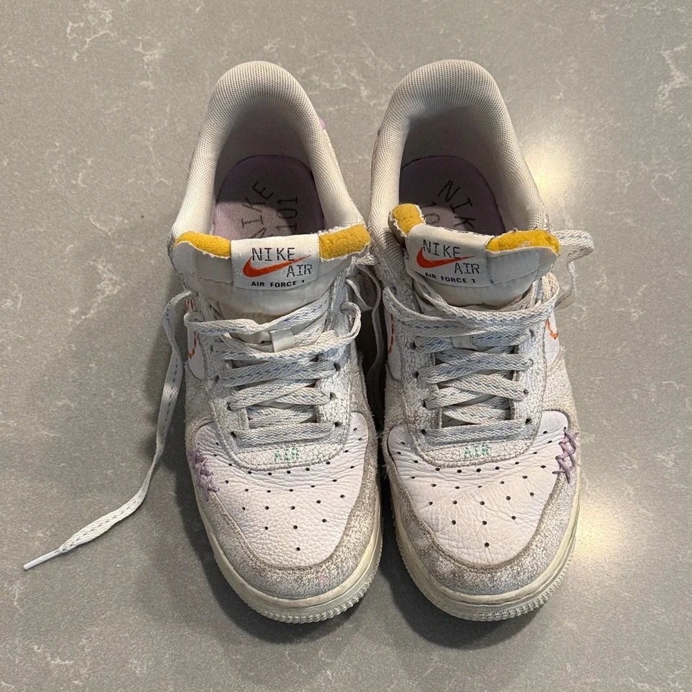 Nike Air Force 1 White and Purple Athletic Shoes stitched design
